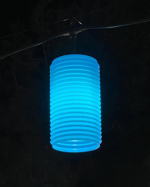 The Shimmer lantern cover glowing blue at night — Groovy Lanterns
